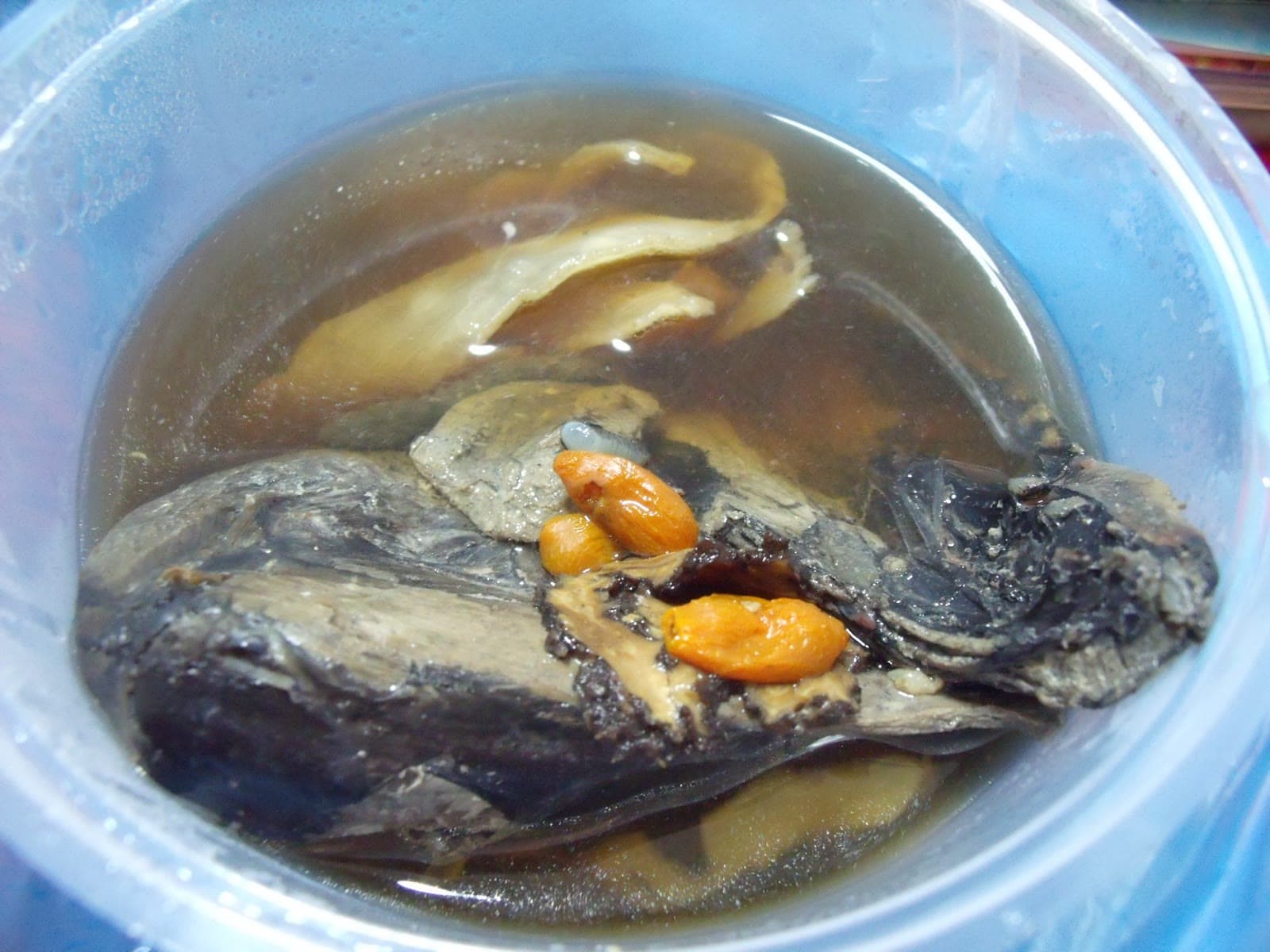 A bowl of black chicken herbal soup