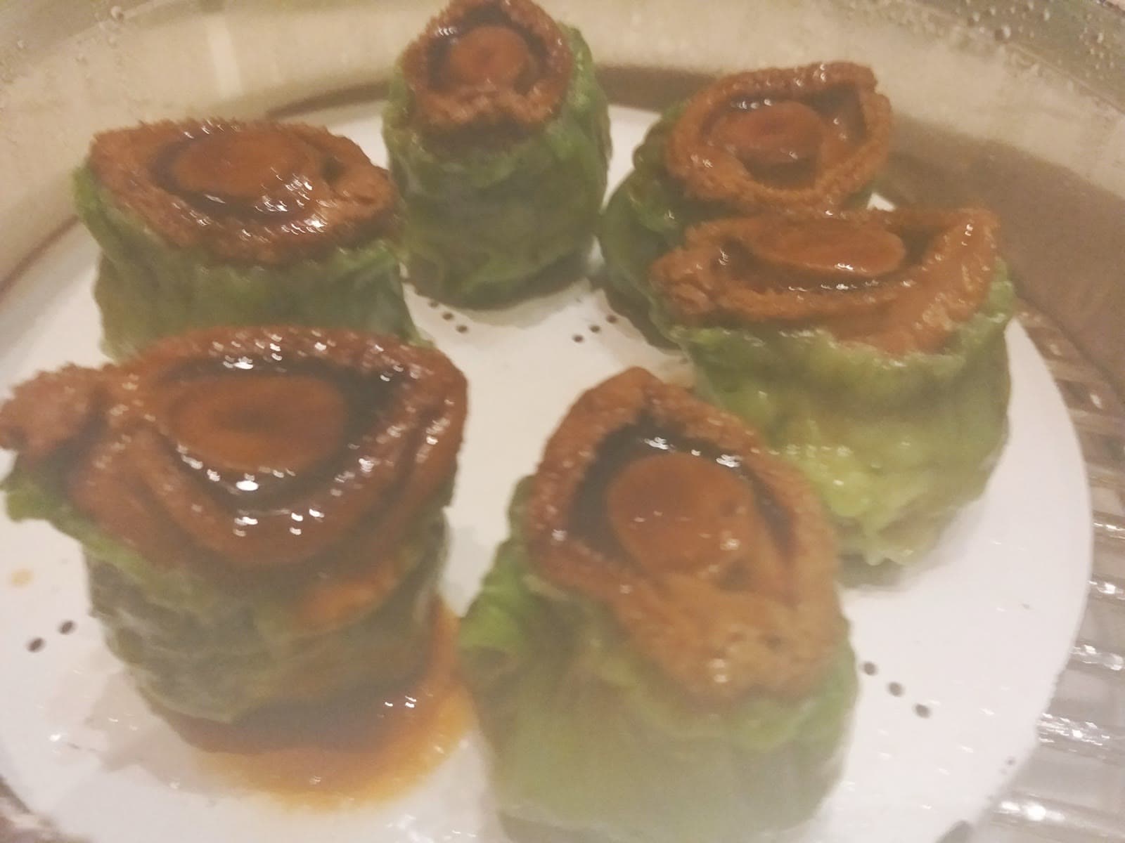 Steamed dim sum served inside bamboo steamers